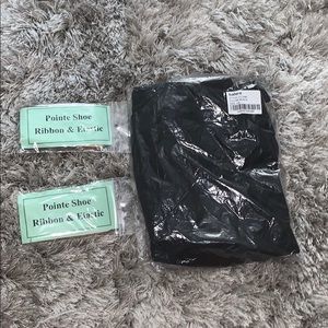 Black leotard and pointe shoe ribbon and elastic